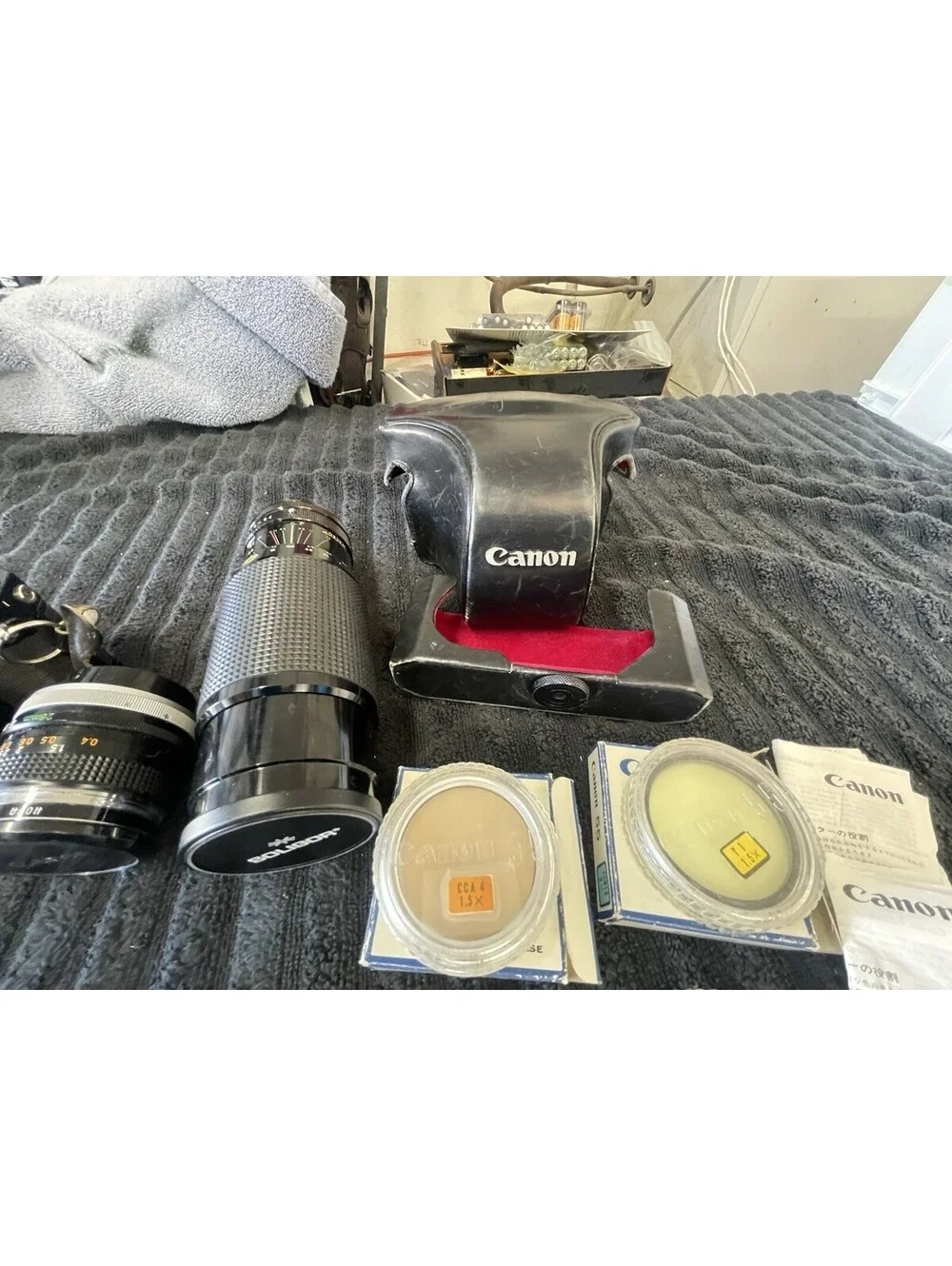 CANON F-1 FILM CAMERA WITH LENSES, CASE, FILM AND MORE  *TESTED, READ DESC*